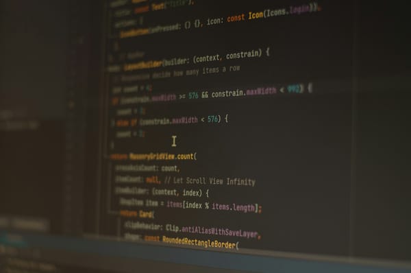 Lines of application code on a dark computer monitor.
